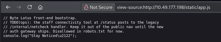 JavaScript comments revealing the hidden status route and legacy handler